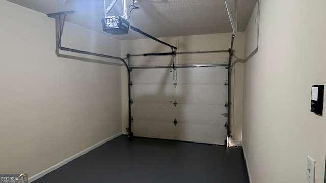 7055 Blairs View Dr Unit 1, Austell, GA 30168 - garage with a garage door opener and baseboards