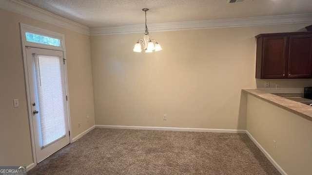 7055 Blairs View Dr Unit 1, Austell, GA 30168 - unfurnished dining area featuring crown molding, a chandelier, carpet, and baseboards