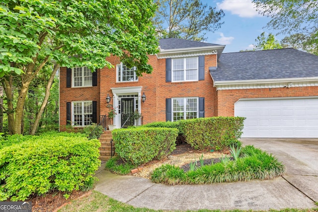 4250 Edgewater Ct NW, Kennesaw, GA 30144 - view of front of house with roof with shingles, driveway, a garage, and brick siding