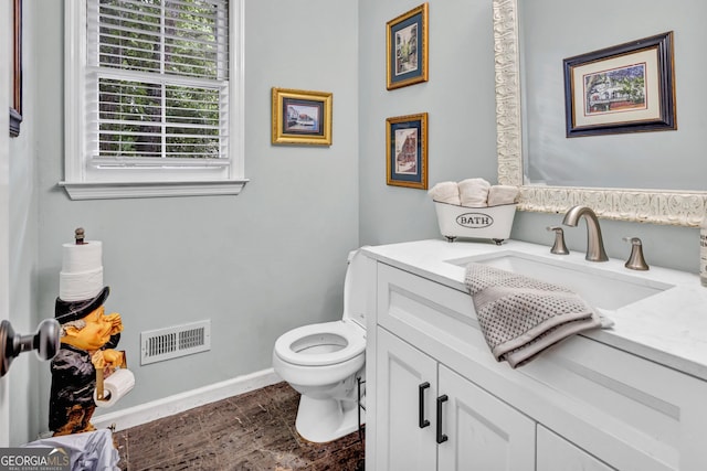 4250 Edgewater Ct NW, Kennesaw, GA 30144 - bathroom featuring vanity, toilet, wood finished floors, and baseboards