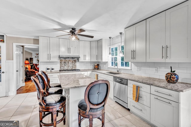 4250 Edgewater Ct NW, Kennesaw, GA 30144 - kitchen with a sink, appliances with stainless steel finishes, a ceiling fan, ornamental molding, and a kitchen island