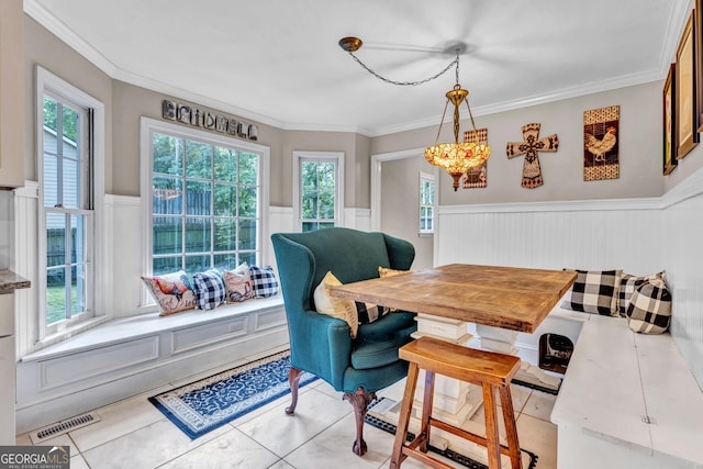 4250 Edgewater Ct NW, Kennesaw, GA 30144 - dining space with a wainscoted wall, ornamental molding, light tile patterned floors, and breakfast area