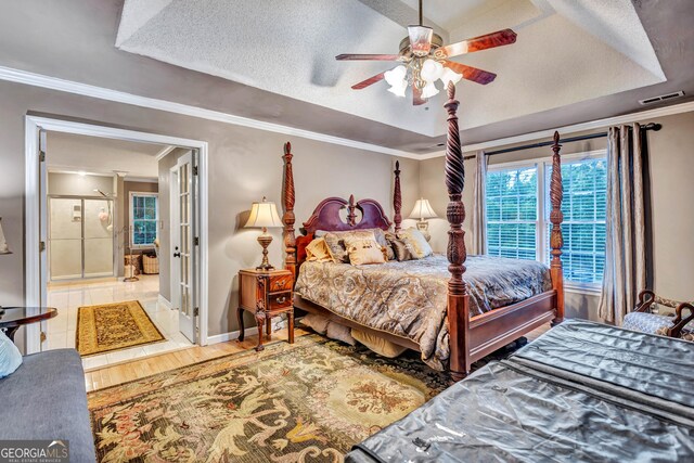 4250 Edgewater Ct NW, Kennesaw, GA 30144 - bedroom featuring crown molding, baseboards, a raised ceiling, wood finished floors, and a ceiling fan