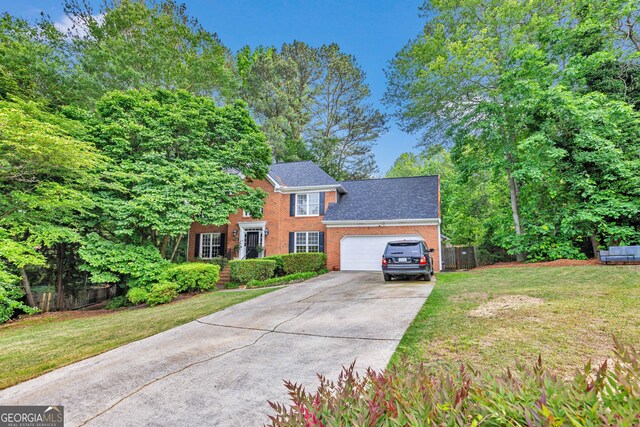 4250 Edgewater Ct NW, Kennesaw, GA 30144 - colonial home featuring an attached garage, brick siding, and concrete driveway
