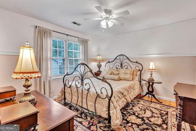 4250 Edgewater Ct NW, Kennesaw, GA 30144 - bedroom with baseboards, wood finished floors, and a ceiling fan