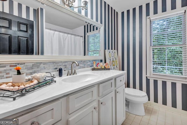 4250 Edgewater Ct NW, Kennesaw, GA 30144 - bathroom featuring wallpapered walls, tile patterned flooring, plenty of natural light, and vanity