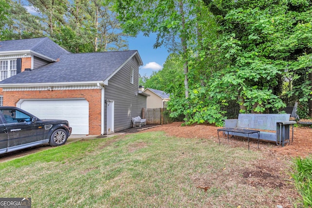 4250 Edgewater Ct NW, Kennesaw, GA 30144 - view of side of home with brick siding, roof with shingles, and a garage