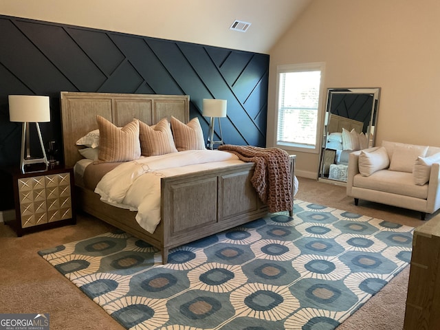 carpeted bedroom featuring high vaulted ceiling