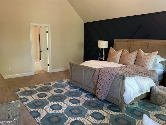 bedroom with baseboards, carpet flooring, and vaulted ceiling
