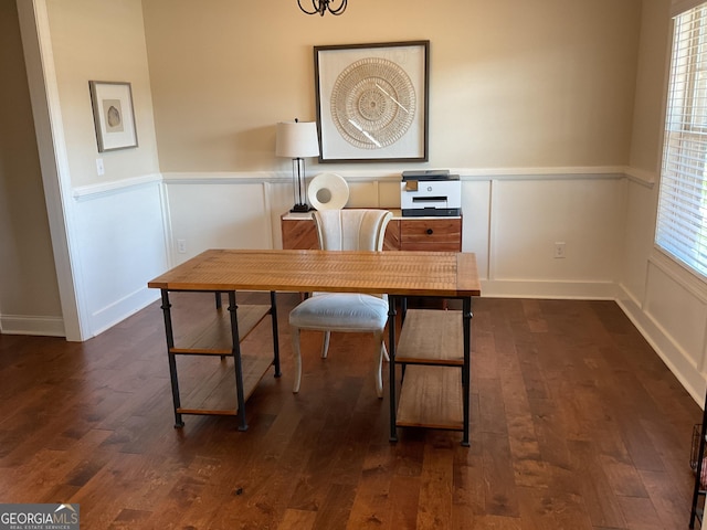 office with a wainscoted wall, dark wood finished floors, and a decorative wall