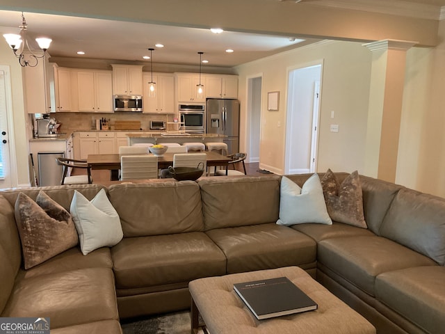 living area featuring ornamental molding, recessed lighting, baseboards, and a chandelier