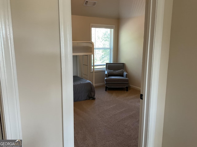 bedroom with carpet and baseboards