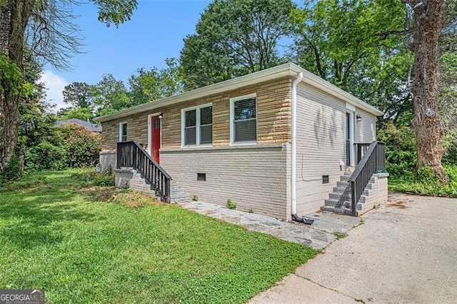 3456 Maryvale Dr, Decatur, GA 30032 - view of front of home with brick siding, stairs, and a front lawn