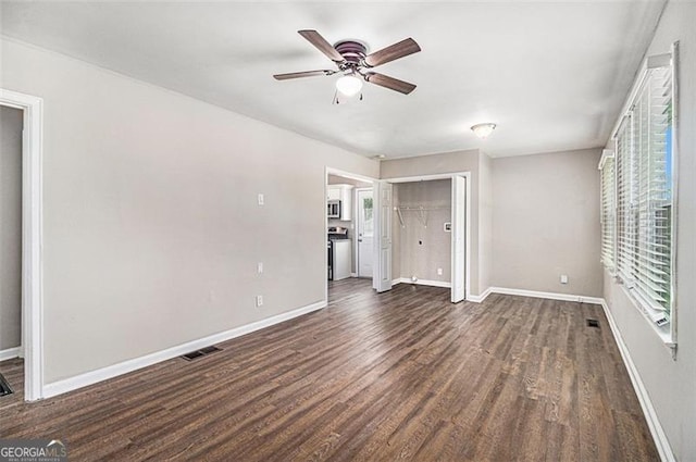 3456 Maryvale Dr, Decatur, GA 30032 - unfurnished bedroom featuring dark wood-style floors, baseboards, and a ceiling fan