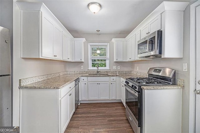 3456 Maryvale Dr, Decatur, GA 30032 - kitchen featuring appliances with stainless steel finishes, a sink, white cabinets, and dark wood-style floors