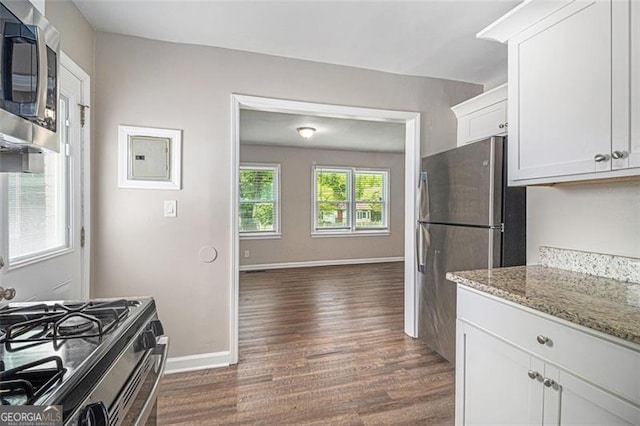 3456 Maryvale Dr, Decatur, GA 30032 - kitchen with stainless steel appliances, dark wood-type flooring, white cabinets, light stone countertops, and baseboards