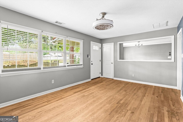 125 Sycamore Dr, Athens, GA 30606 - entrance foyer with wood finished floors and a chandelier