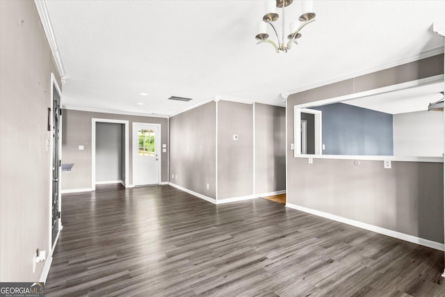 125 Sycamore Dr, Athens, GA 30606 - unfurnished living room featuring crown molding, wood finished floors, and a chandelier