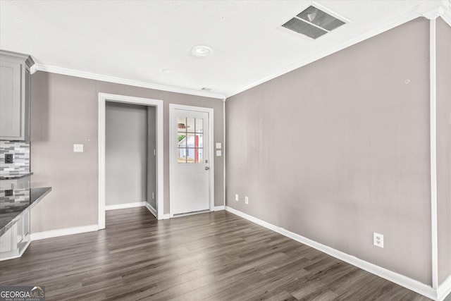 125 Sycamore Dr, Athens, GA 30606 - unfurnished dining area featuring ornamental molding and dark wood-style floors