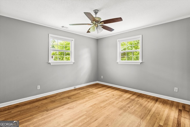 125 Sycamore Dr, Athens, GA 30606 - spare room featuring plenty of natural light, ceiling fan, wood finished floors, and ornamental molding