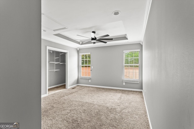 125 Sycamore Dr, Athens, GA 30606 - unfurnished bedroom featuring a tray ceiling, crown molding, carpet, attic access, and a closet