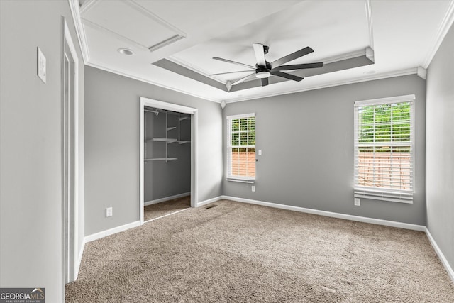 125 Sycamore Dr, Athens, GA 30606 - unfurnished bedroom featuring crown molding, attic access, carpet floors, a closet, and a tray ceiling