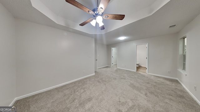 700 Patriots Point St, Locust Grove, GA 30248 - carpeted empty room featuring baseboards, a ceiling fan, and a tray ceiling