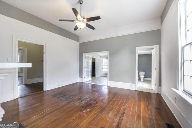 611 Monroe St, Macon, GA 31201 - unfurnished living room with ceiling fan, hardwood / wood-style floors, and baseboards
