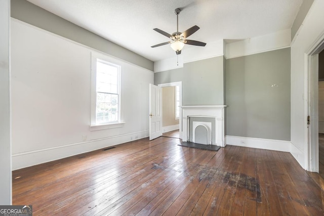 611 Monroe St, Macon, GA 31201 - unfurnished living room with ceiling fan, wood-type flooring, baseboards, and a fireplace