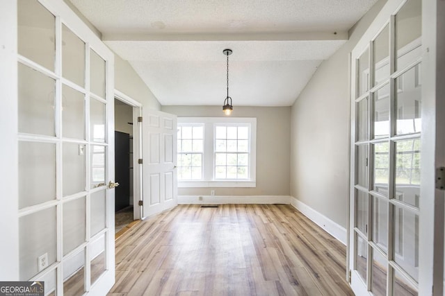 611 Monroe St, Macon, GA 31201 - unfurnished dining area featuring french doors, wood finished floors, and baseboards