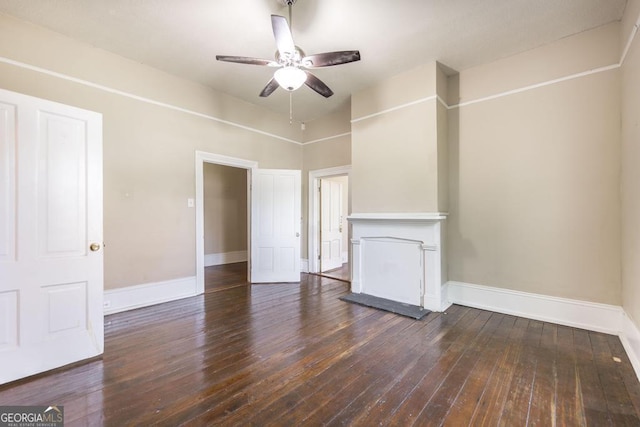 611 Monroe St, Macon, GA 31201 - unfurnished living room featuring baseboards, a ceiling fan, and dark wood-type flooring