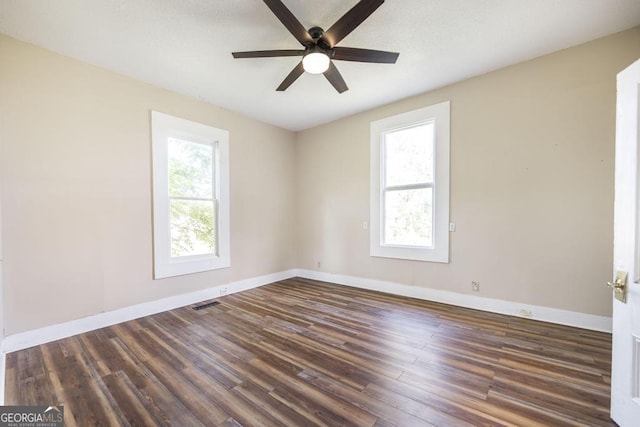 611 Monroe St, Macon, GA 31201 - empty room with ceiling fan, wood finished floors, and baseboards