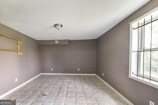 611 Monroe St, Macon, GA 31201 - unfurnished room featuring a textured ceiling and baseboards