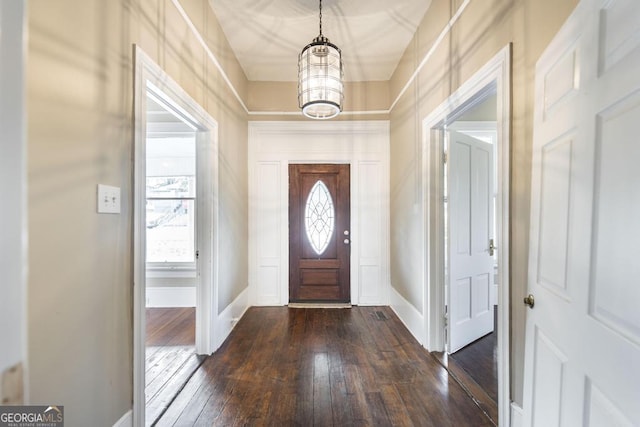 611 Monroe St, Macon, GA 31201 - entryway featuring dark wood-style flooring, a chandelier, baseboards, and plenty of natural light