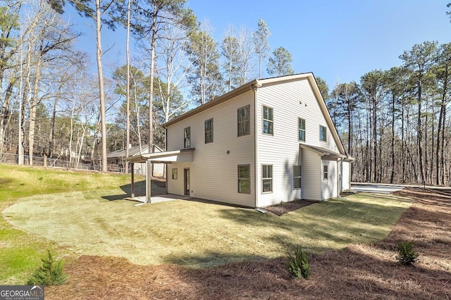 view of side of home featuring a patio area