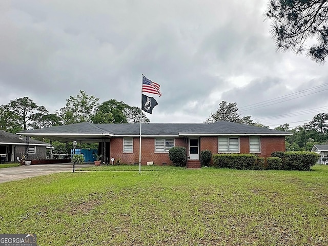 single story home with driveway, a carport, a front lawn, and entry steps
