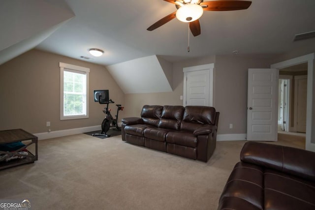 carpeted living room featuring baseboards, ceiling fan, and vaulted ceiling