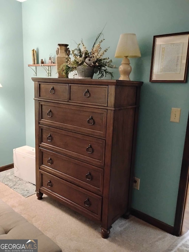 detailed view of carpet floors and baseboards