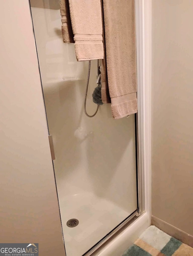 full bathroom with a stall shower