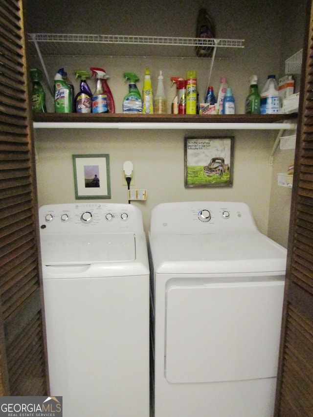 clothes washing area featuring washing machine and clothes dryer