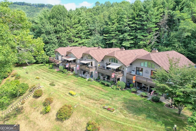 view from above of property featuring a forest