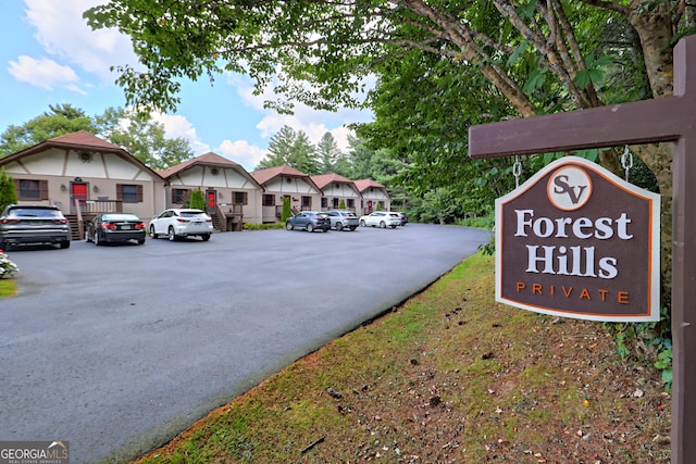 view of asphalt road featuring a residential view