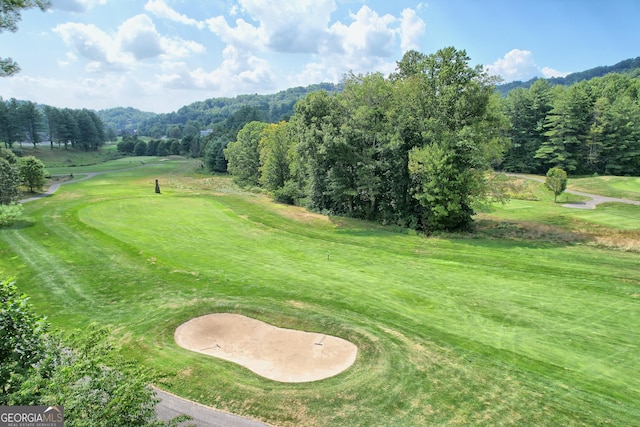 view of property's community with view of golf course