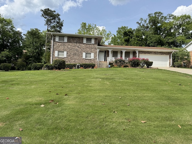 3662 Greentree Farms Dr, Decatur, GA 30034 - tri-level home featuring a porch, a garage, a front yard, concrete driveway, and brick siding