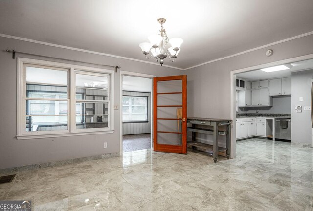 1254 NE Woodland Rd, Conyers, GA 30012 - empty room with plenty of natural light, a ceiling fan, crown molding, marble finish flooring, and baseboards