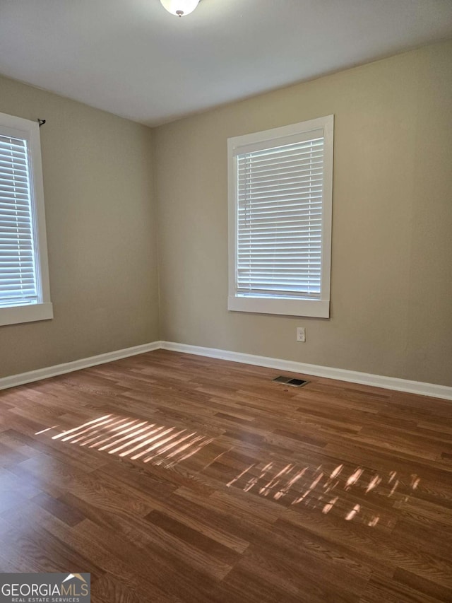 6136 Holiday Blvd, Forest Park, GA 30297 - unfurnished room with baseboards and wood finished floors