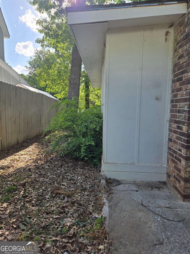 6136 Holiday Blvd, Forest Park, GA 30297 - entrance to property with fence and brick siding