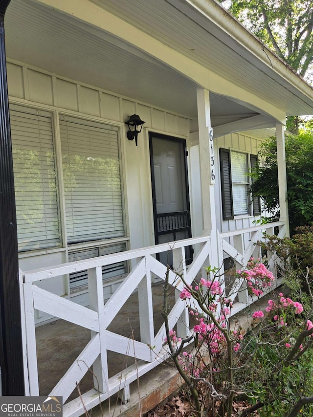 6136 Holiday Blvd, Forest Park, GA 30297 - entrance to property featuring board and batten siding and a porch