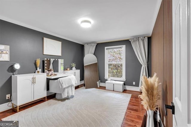 office with crown molding, baseboards, and wood finished floors