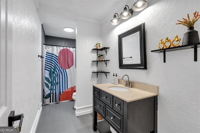 bathroom with tile patterned flooring, vanity, toilet, baseboards, and a shower with shower curtain